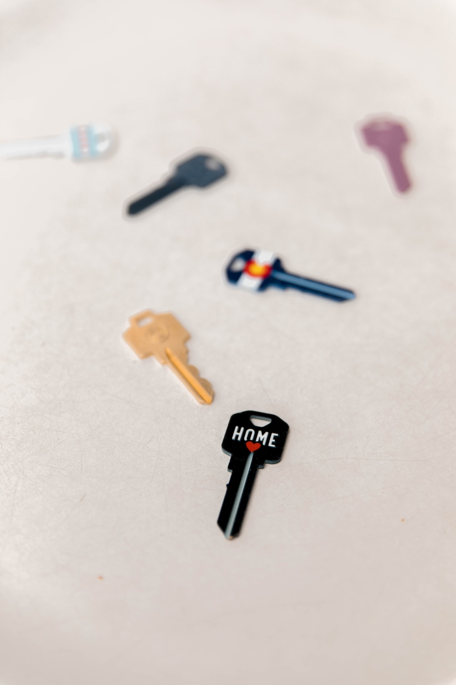 This is an image of a bunch of keys with only the main key being the key to home