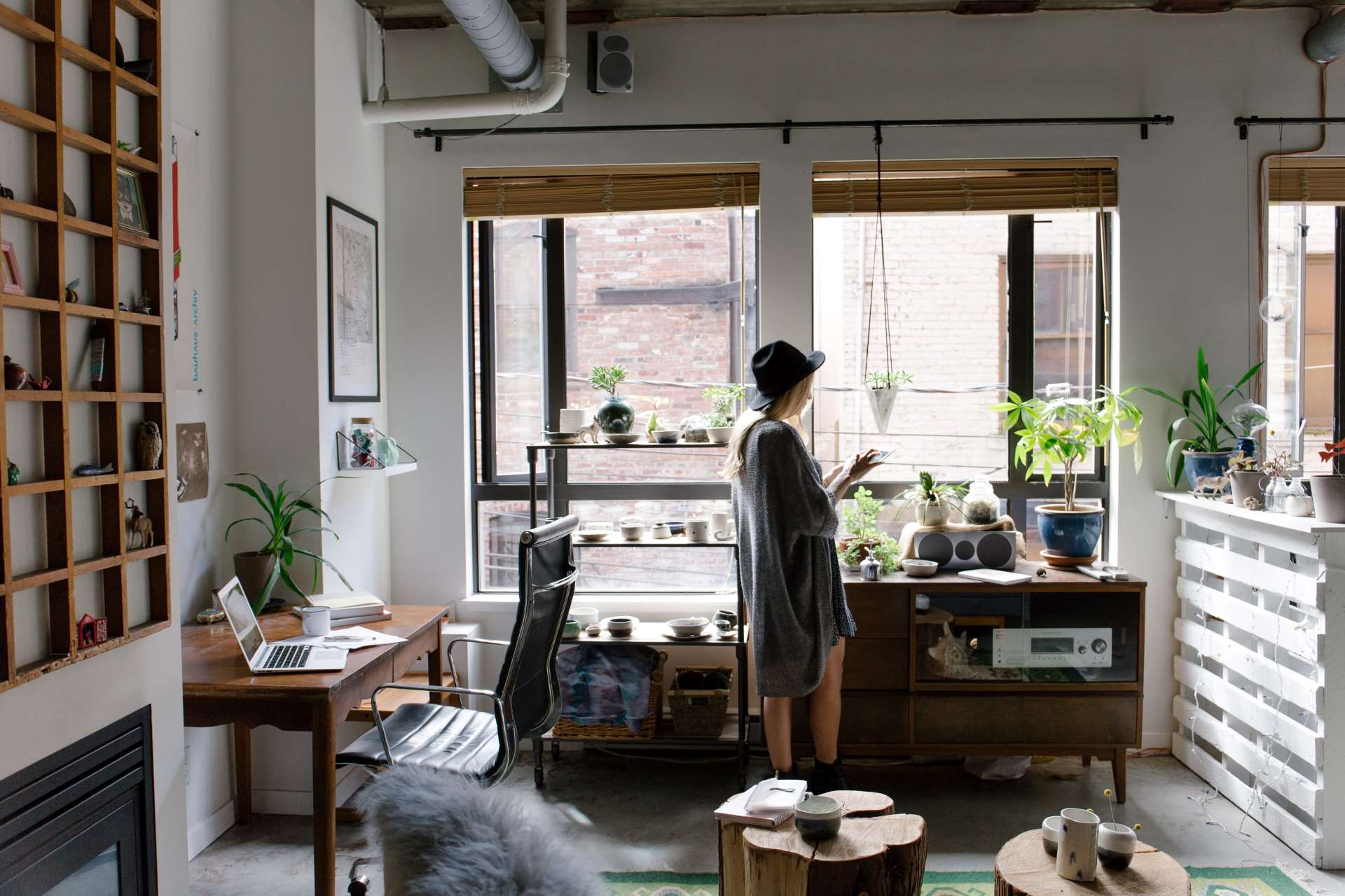This is an image of an apartment with a lady looking out of a window