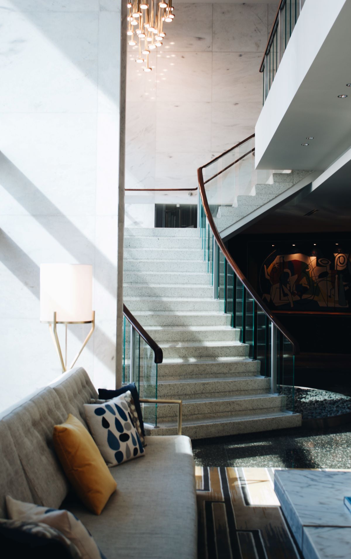 This is an image of a staircase that drops down to a lounge suite