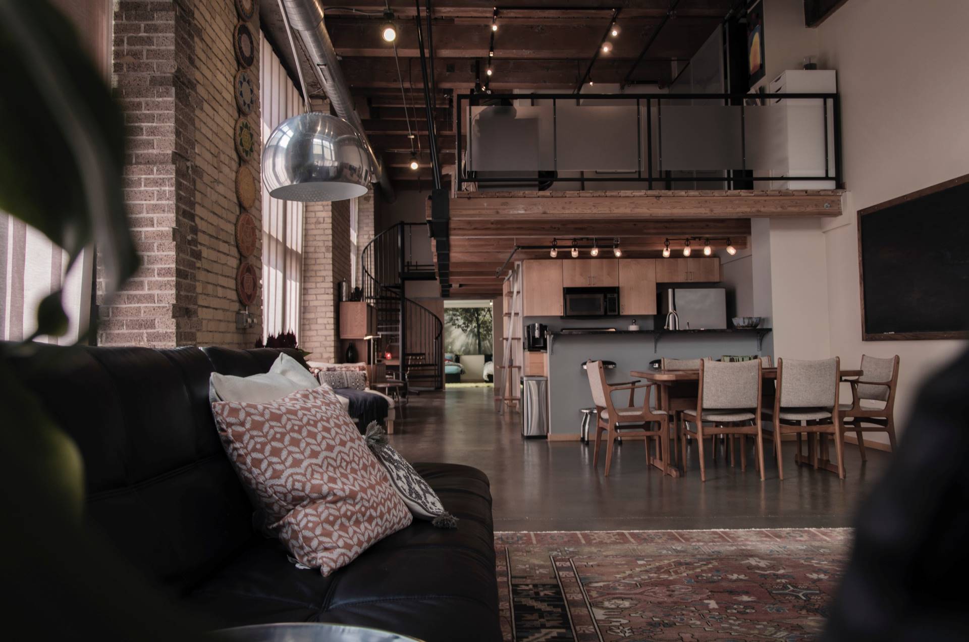 This is an image of a living room with a kitchen