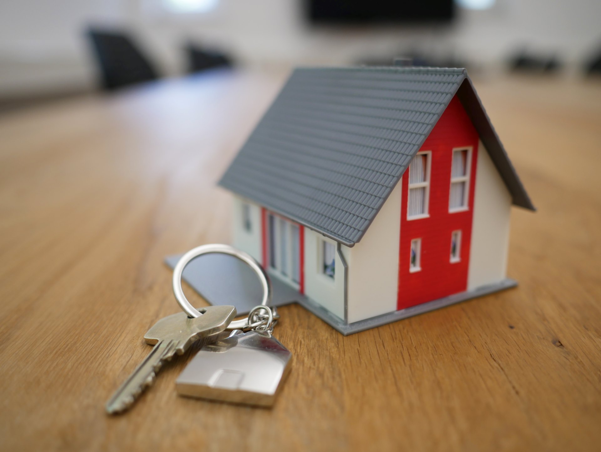 This is an image of a small home and key to symbolize the start of a new home